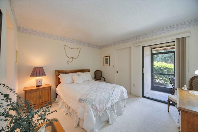 bedroom featuring access to outside, light colored carpet, and a textured ceiling