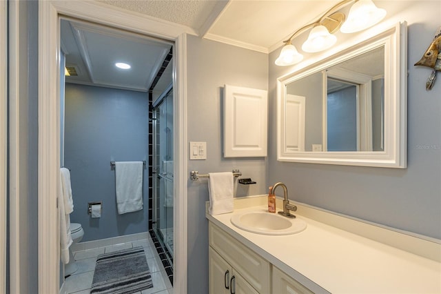 bathroom with vanity, a shower with door, tile patterned floors, crown molding, and toilet