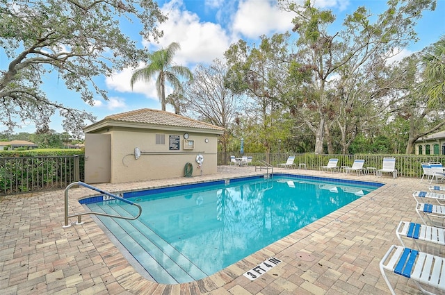 view of swimming pool with a patio