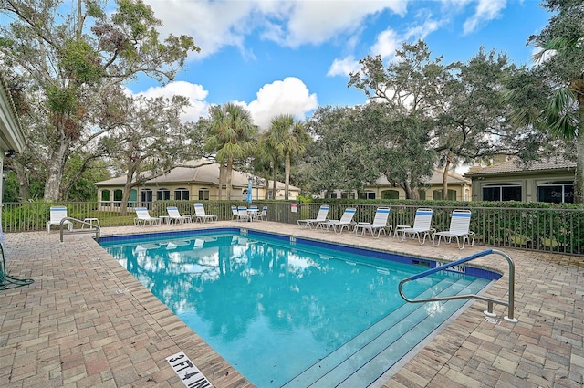 view of swimming pool with a patio