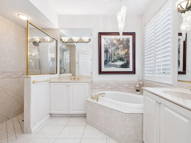 bathroom featuring tile patterned floors, vanity, and plus walk in shower