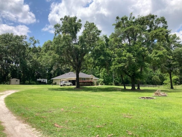 view of home's community featuring a lawn