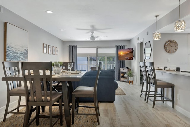 dining area featuring ceiling fan and light hardwood / wood-style floors