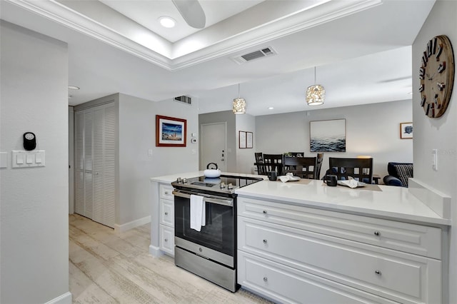 kitchen featuring white cabinetry, light hardwood / wood-style floors, decorative light fixtures, stainless steel electric range, and ornamental molding