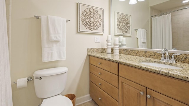 bathroom with toilet and vanity