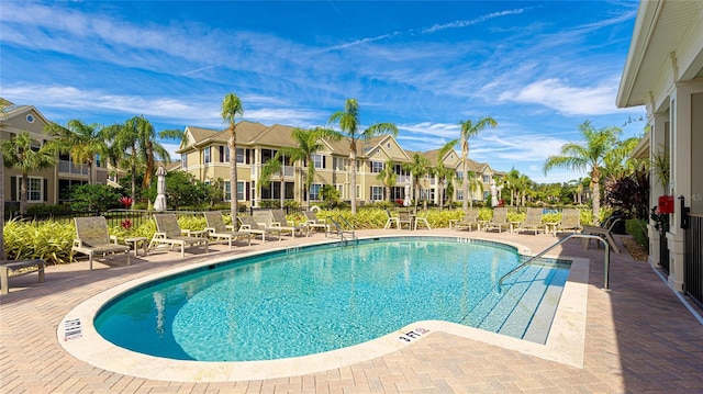 view of swimming pool featuring a patio area