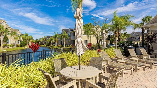 view of patio with a water view