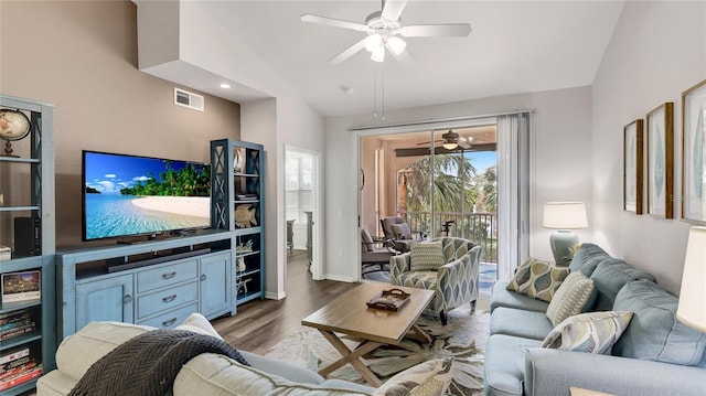 living room featuring ceiling fan, wood-type flooring, and lofted ceiling