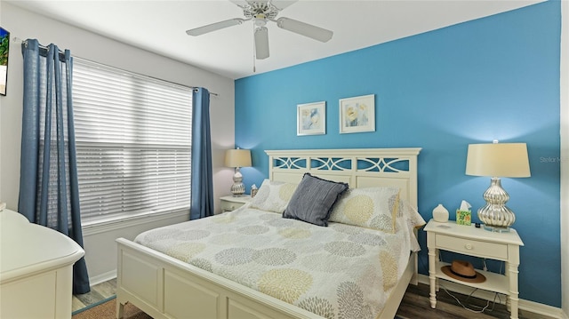 bedroom with hardwood / wood-style floors and ceiling fan