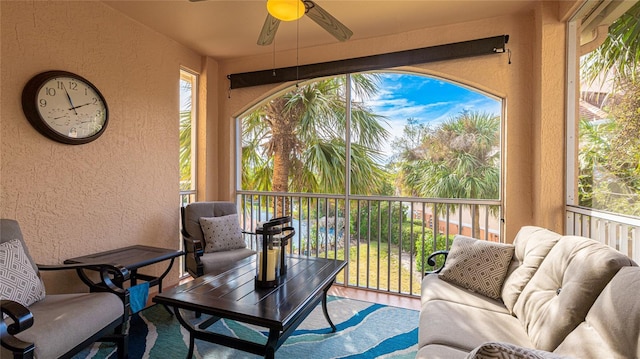 exterior space featuring ceiling fan