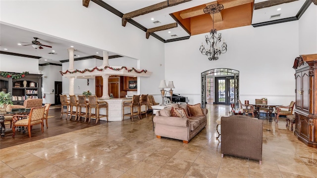 living room featuring a towering ceiling, decorative columns, coffered ceiling, ceiling fan, and beam ceiling