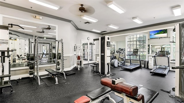 gym featuring ceiling fan and crown molding