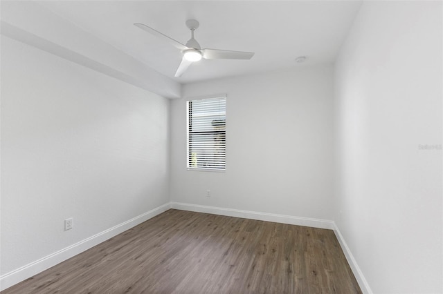 spare room with hardwood / wood-style flooring and ceiling fan