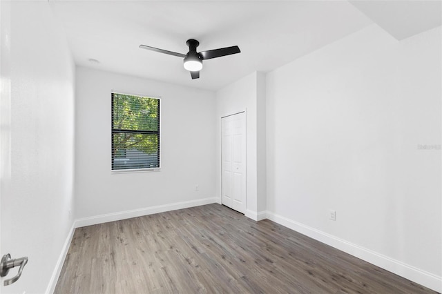 unfurnished room featuring wood-type flooring and ceiling fan