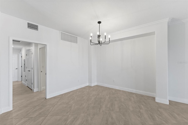 unfurnished dining area featuring crown molding and a notable chandelier