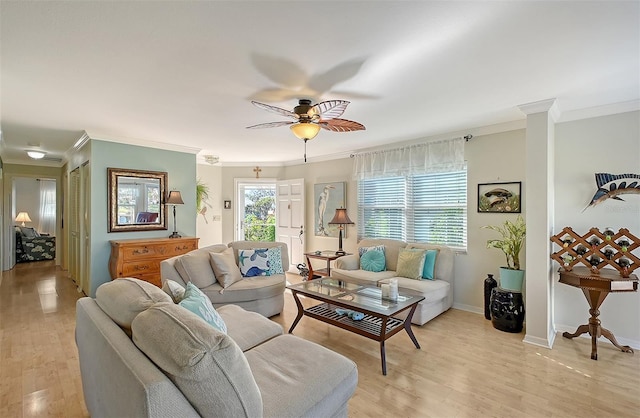 living room with light wood-type flooring, ceiling fan, and crown molding