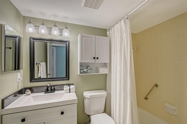 full bathroom featuring shower / bath combination with curtain, vanity, and toilet