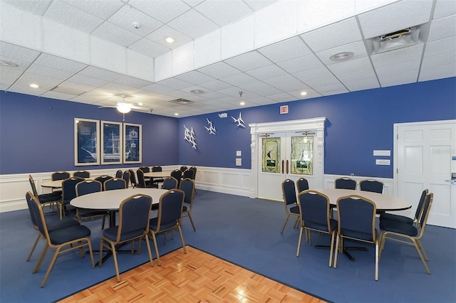 dining area featuring parquet flooring