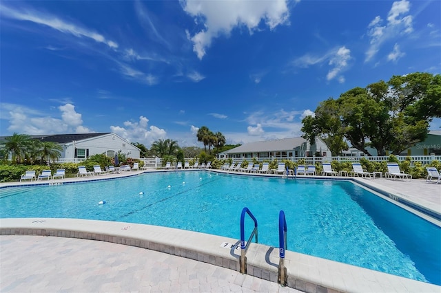 view of swimming pool with a patio