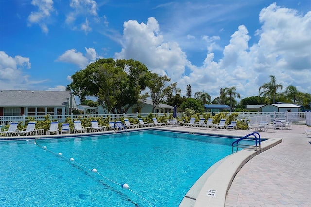 view of swimming pool featuring a patio area