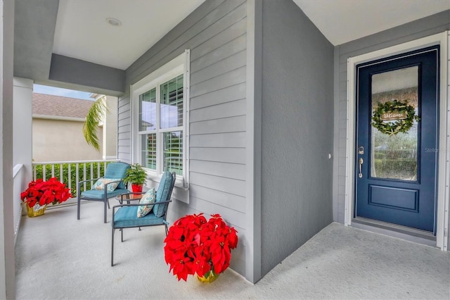 property entrance featuring covered porch