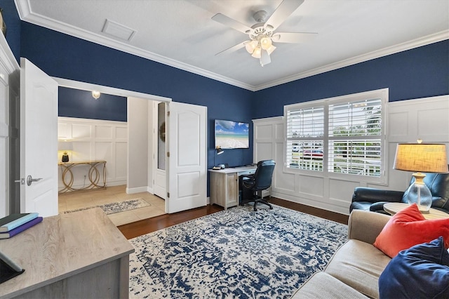 office area featuring crown molding, light hardwood / wood-style flooring, and ceiling fan