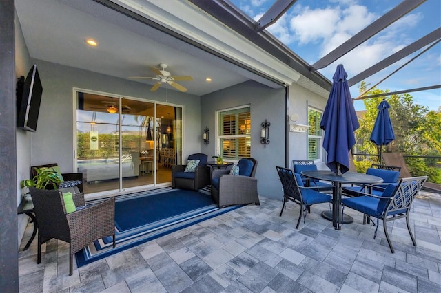 view of patio with a lanai and ceiling fan