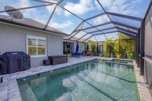 view of swimming pool with a lanai, a patio, and grilling area