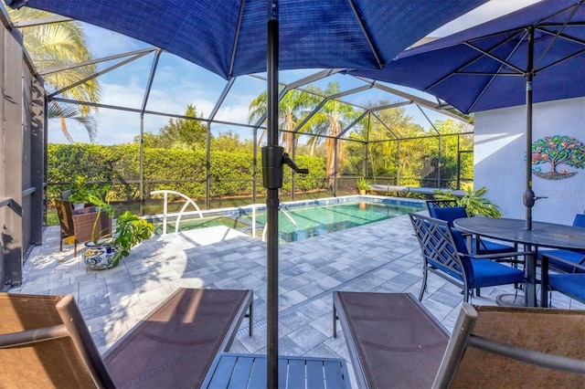 view of patio with glass enclosure