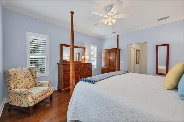 bedroom with ceiling fan, crown molding, and dark hardwood / wood-style floors