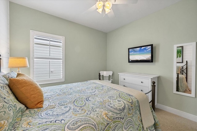 bedroom with ceiling fan and light carpet