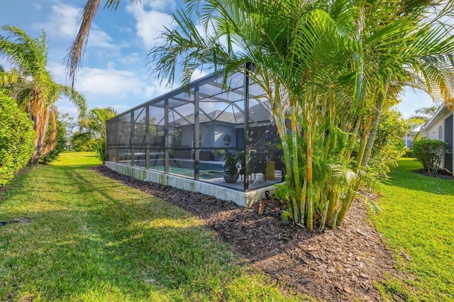 view of yard with glass enclosure