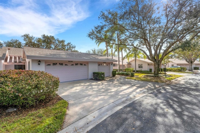 single story home featuring a garage