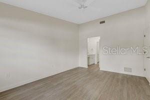 empty room with dark hardwood / wood-style floors