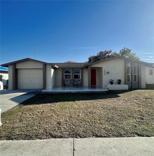 ranch-style house with a front lawn and a garage