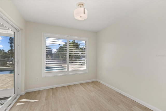 unfurnished room featuring light wood-type flooring