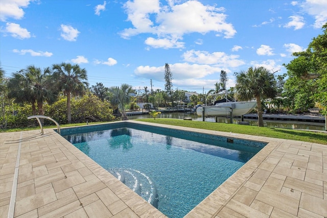 view of swimming pool with a water view and a patio