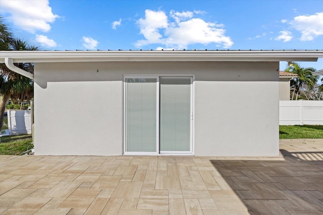 rear view of property featuring a patio