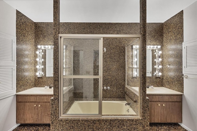 bathroom with vanity and tile walls