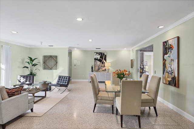 dining area featuring crown molding