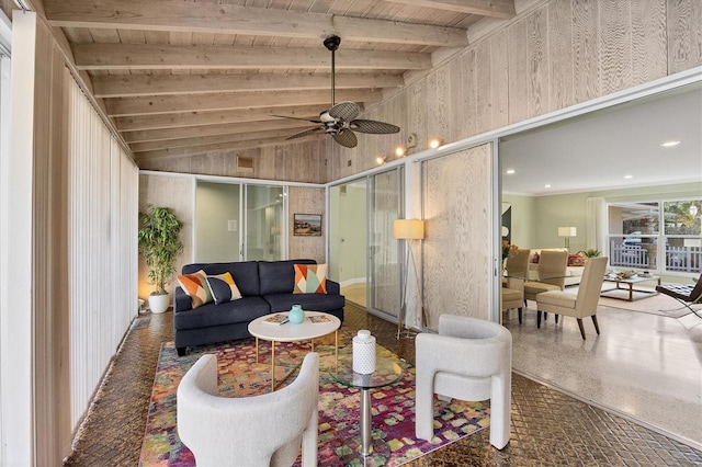 living room with vaulted ceiling with beams, wooden ceiling, and ceiling fan