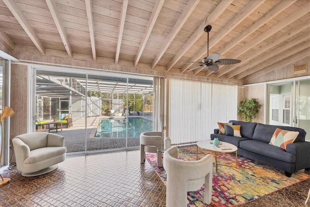 sunroom / solarium with vaulted ceiling with beams, wooden ceiling, and ceiling fan