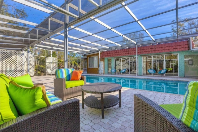 view of pool with a patio, area for grilling, an outdoor hangout area, and glass enclosure