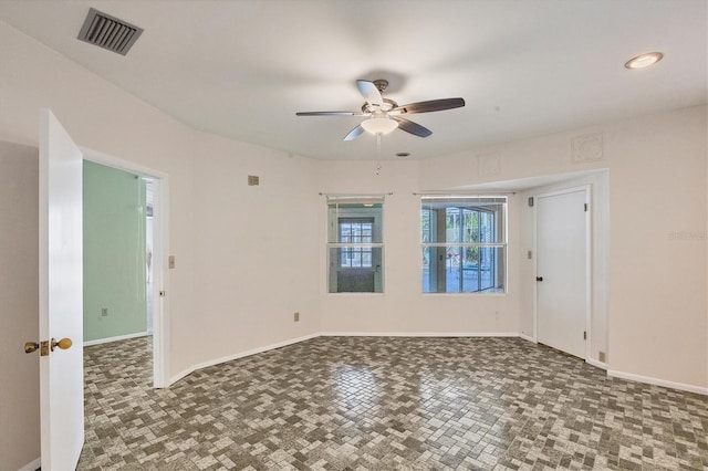 empty room featuring ceiling fan