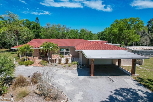 view of front facade with a carport