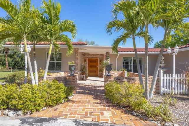 view of front of home with a tiled roof