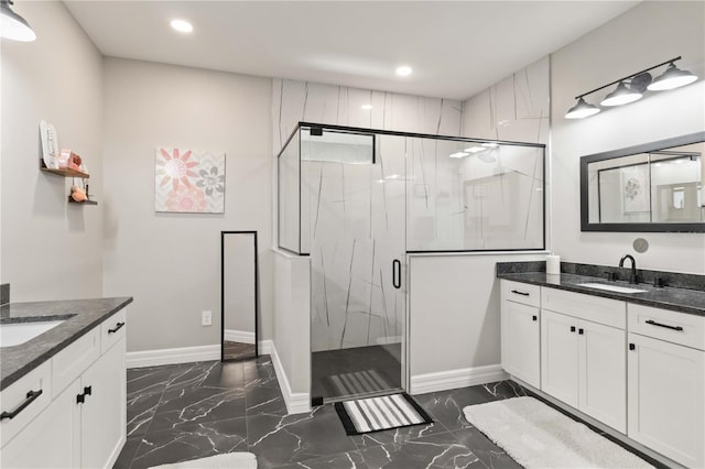 bathroom with vanity and an enclosed shower