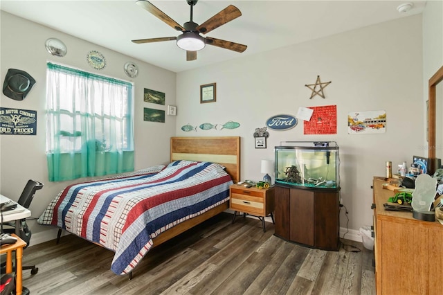 bedroom with ceiling fan and dark wood-type flooring