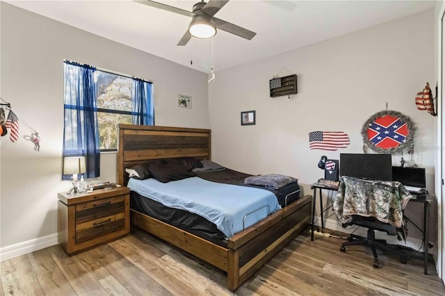 bedroom with hardwood / wood-style flooring and ceiling fan