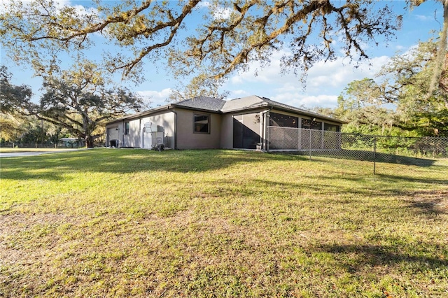 view of yard with a sunroom